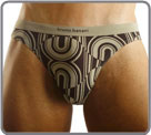 Psychedelic pattern from the Seventies. Printed bronw on oliv ground.