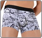 A soft, fluid and comfortable material with an original pattern made with newspapers, graffiti and stamps.Rubber waistband with logo. Lined front pouch.