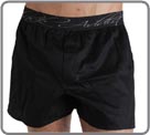 Beautiful innovation associating long boxershorts in glossed cotton with an internal suspending rod (partial brief in front of). Look of fashion pants and brief support in the same product. Slits of ease on the sides. Front pouch with fake opening.