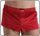 Beautiful innovation associating mini boxershorts in glossed cotton with an internal suspending rod (partial brief in front of). Look of sexy pants and brief support in the same product. Slits of ease on the sides. Front pouch with fake opening.
