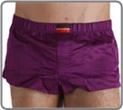 Beautiful innovation associating mini boxershorts in glossed cotton with an internal suspending rod (partial brief in front of). Look of sexy pants and brief support in the same product. Slits of ease on the sides. Front pouch with fake opening.