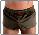 Beautiful innovation associating mini boxershorts in glossed cotton with an internal suspending rod (partial brief in front of). Look of sexy pants and brief support in the same product. Slits of ease on the sides. Front pouch with fake opening.