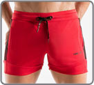 Sports shorts with contrasting colour band and logo on the sides. Un zippered...