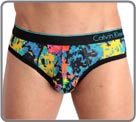 Fine material printed microfibre, pattern Digital Flor. Black waist band raised of a line and logo Calvin Klein, color turquoise. Unlined front pouch.
