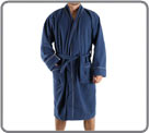 Long dressing gown into polar elegantly raised of a discrete beige gallon. Two pockets. Girdle matched.