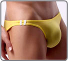 Plain micro briefs with two bars on the side, in contrasting color. Fluid and...